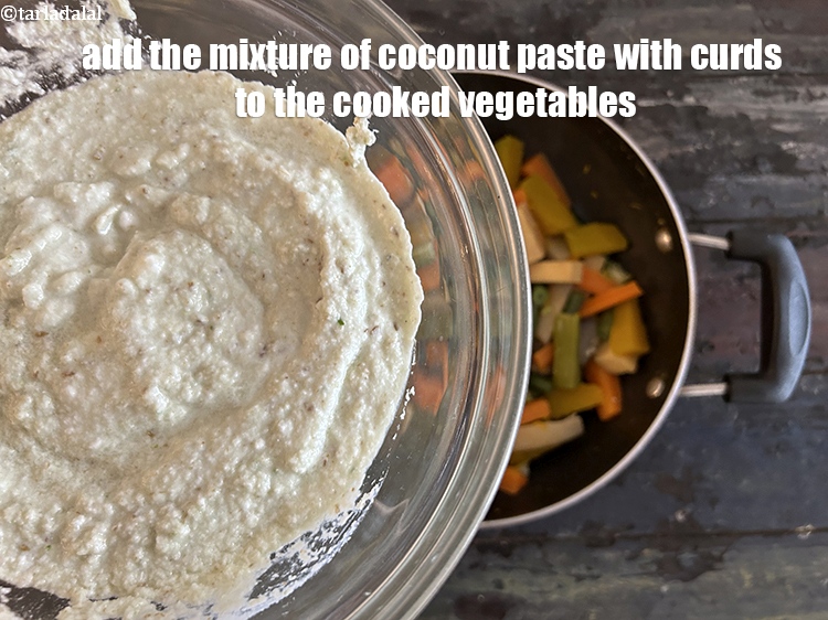 Step 28 – Add the mixture of coconut paste and curds ( yoghurt ) to cooked vegetables.