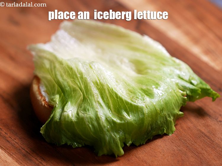 Step 34 – Place an &nbsp;<a href="https://www.tarladalal.com/glossary-iceberg-lettuce-iceberg-salad-ke-patte-499i">iceberg lettuce</a>&nbsp;on the lower half.