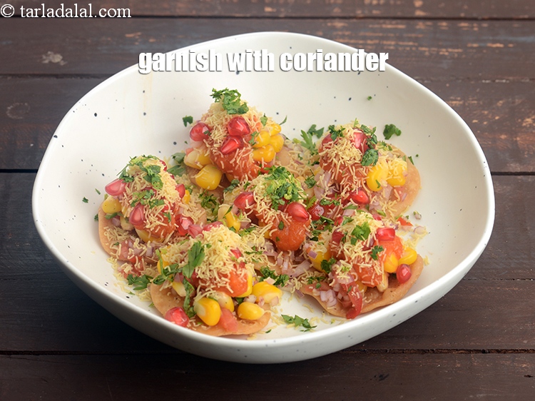 Step 34 – Garnish&nbsp;with finely&nbsp;<a href="https://www.tarladalal.com/glossary-chopped-coriander-783i">chopped coriander (dhania)</a>.