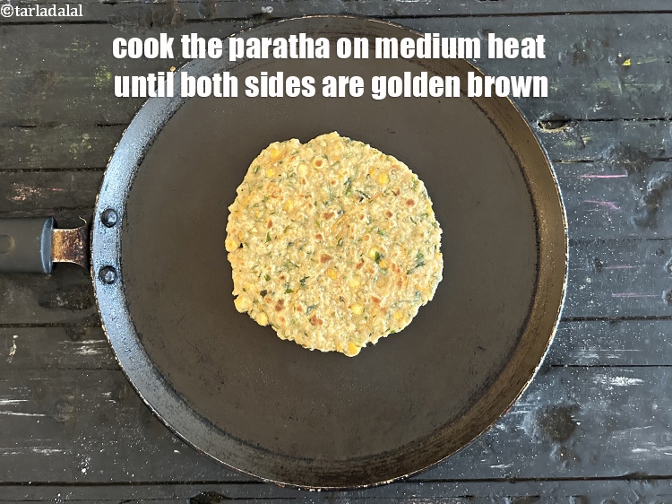 Step 29 – <meta charset="UTF-8" />Cook the paratha on medium heat until both sides are golden brown.&nbsp;