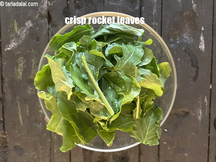 Step 6 – Crsip&nbsp;&nbsp;<a href="https://www.tarladalal.com/glossary-rocket-leaves-arugula-1379i">rocket leaves (arugula)</a>.