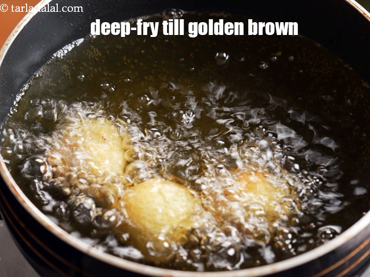 Step 29 – Using a spoon deep-fry it till golden brown in colour.<br /> &nbsp;