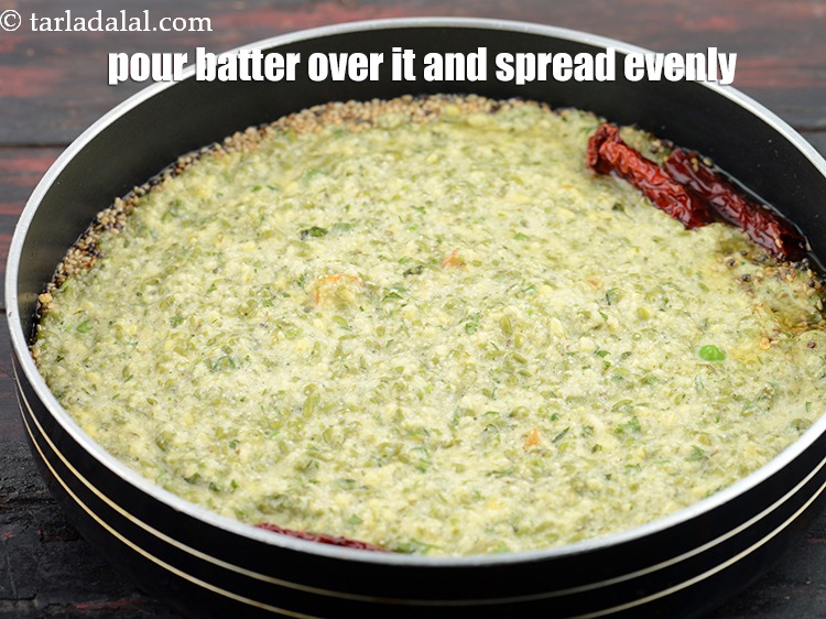 Step 28 – Pour the batter over it and spread it evenly.