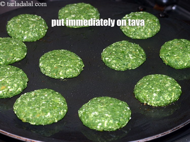 Step 26 – Shape the mixture into flat round kebabs. Put them immediately on the tava.