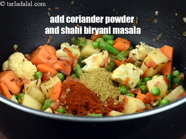 Step 29 – Add&nbsp;1 &frac12; tsp&nbsp;<a href="https://www.tarladalal.com/glossary-coriander-powder-dhania-powder-370i">coriander (dhania) powder</a>&nbsp;and 1 tsp shahi <a href="https://www.tarladalal.com/biryani-masala-42034r">biryani masala</a>.