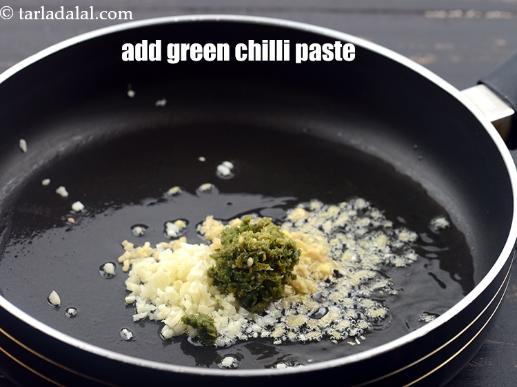 Step 29 – Add 2 tsp <a href="https://www.tarladalal.com/glossary-green-chilli-paste-hari-mirch-ki-paste-mirchi-paste-333i">green chilli paste</a>.