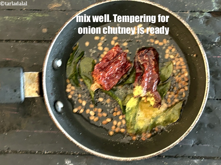 Step 30 – Mix well. Your tempering for onion chutney is ready.