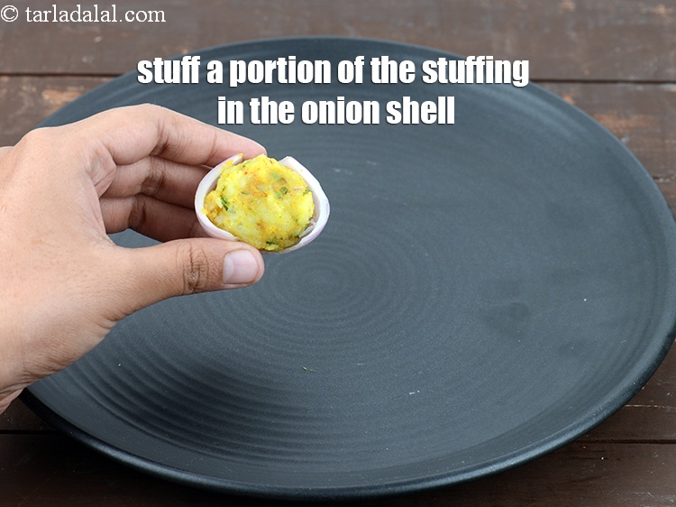 Step 31 – Stuff a portion of the stuffing in the onion shell.