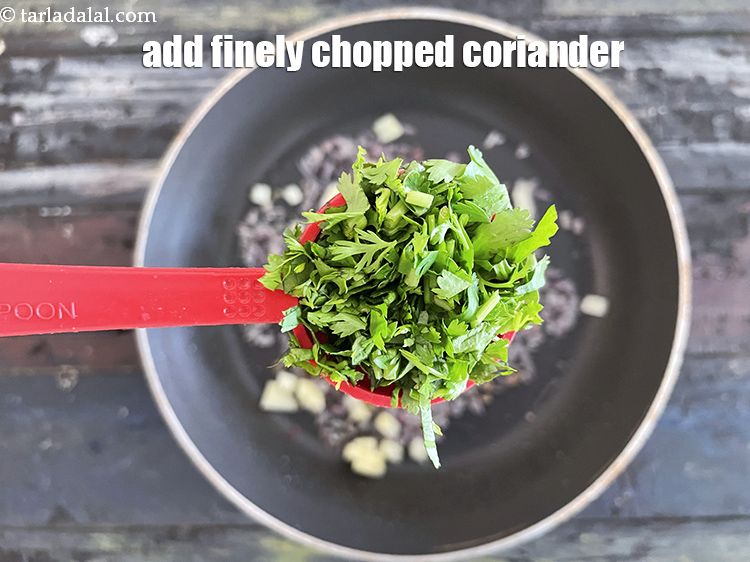 Step 39 – Add&nbsp;<meta charset="UTF-8" />1 tbsp&nbsp;finely&nbsp;<a href="glossary-chopped-coriander-783i">chopped coriander (dhania)</a>.