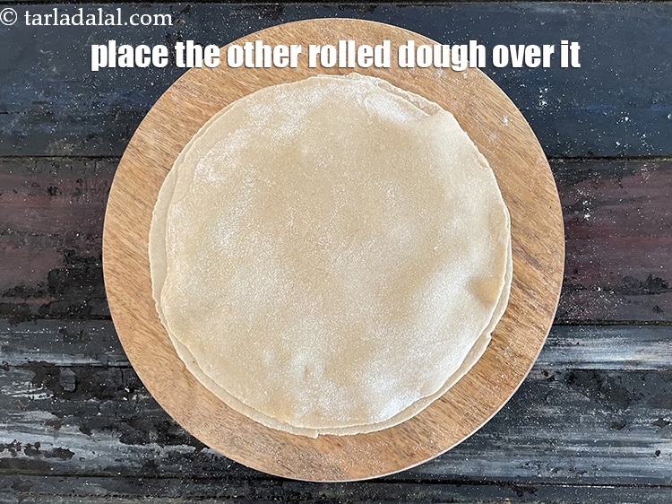 Step 30 – Place the other dough circle over it and seal it.