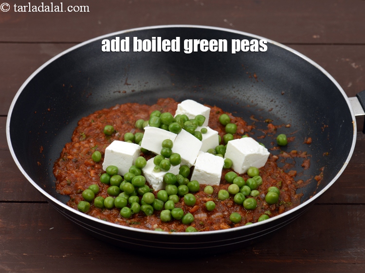 Step 30 – Add &frac14; cup <a href="https://www.tarladalal.com/glossary-boiled-green-peas-1078i">boiled green peas</a>.