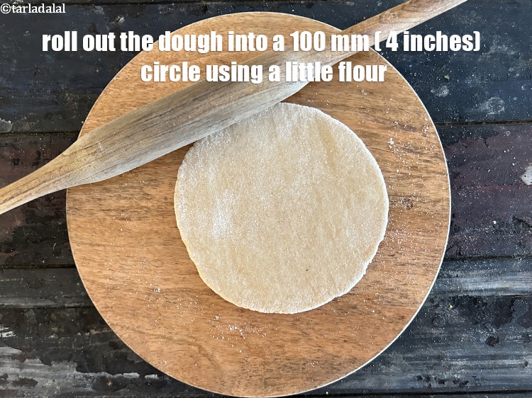 Step 38 – Roll out one portion of the dough into a 100 mm. (4&quot;) diameter circle using …