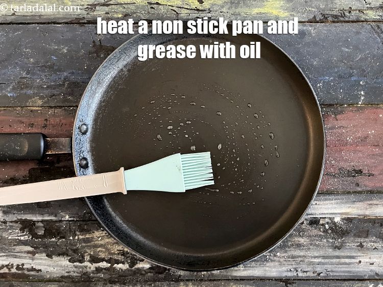 Step 31 – Heat a non stick tava and grease with oil.