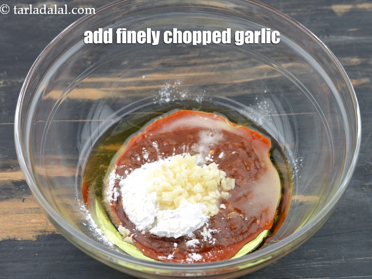 Step 29 – Add 1 tbsp&nbsp;finely&nbsp;<a href="https://www.tarladalal.com/glossary-chopped-garlic-790i">chopped garlic (lehsun)</a>.