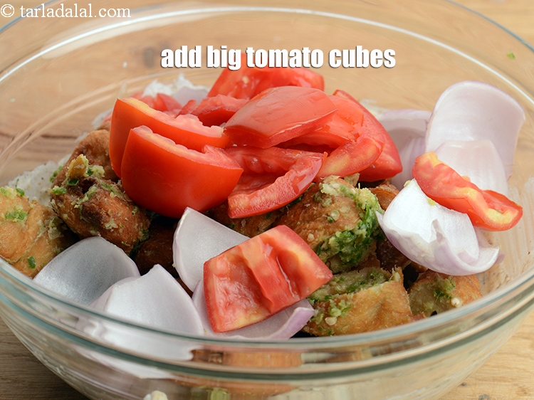 Step 31 – Add &frac12; cup big <a href="https://www.tarladalal.com/glossary-tomato-cubes-728i">tomato cubes</a>.