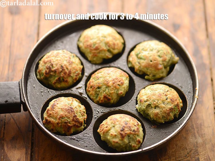 Step 37 – Turnover and cook them on a slow flame till they turn golden brown in colour …