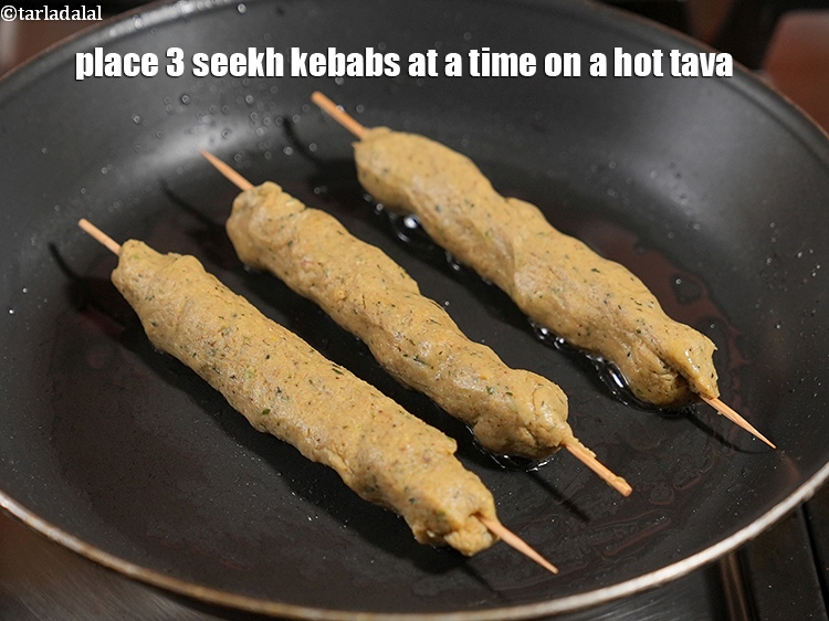 Step 35 – Place 3 seekh kebabs at a time on a hot tava.