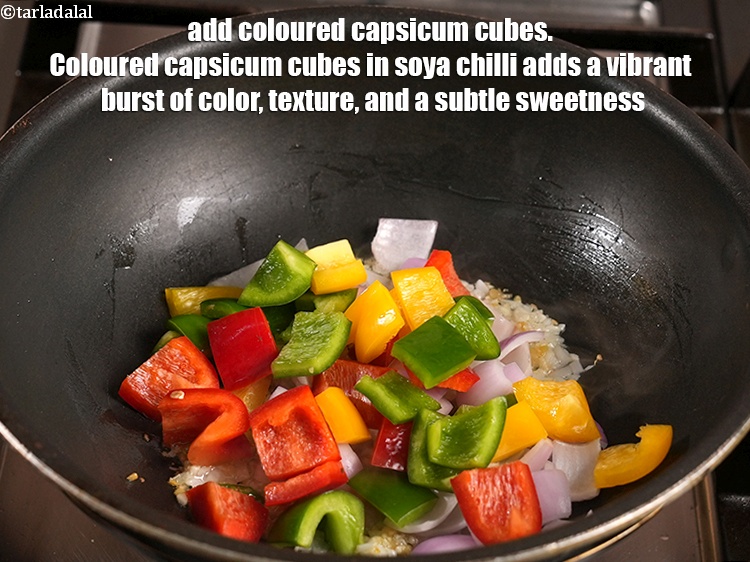 Step 29 – Add &frac12; cup <a href="https://www.tarladalal.com/glossary-coloured-capsicum-cubes-2799i">coloured capsicum cubes</a>. Coloured capsicum cubes in soya chilli adds a …
