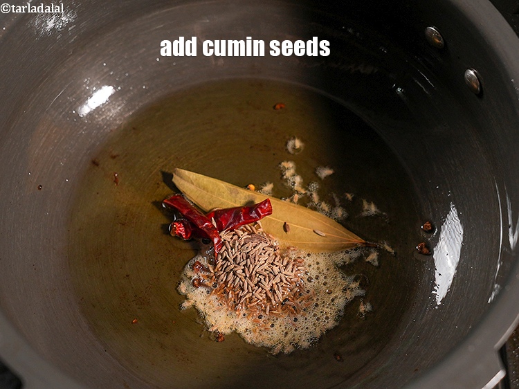 Step 29 – Add 1 tsp <a href="https://www.tarladalal.com/glossary-cumin-seeds-jeera-zeera-381i">cumin seeds (jeera)</a>.