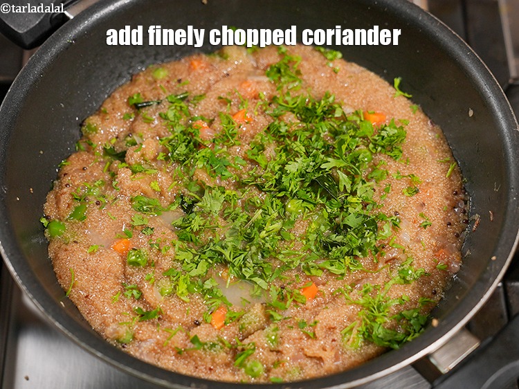 Step 30 – Add 2 tbsp finely <a href="https://www.tarladalal.com/glossary-chopped-coriander-783i">chopped coriander (dhania)</a>.