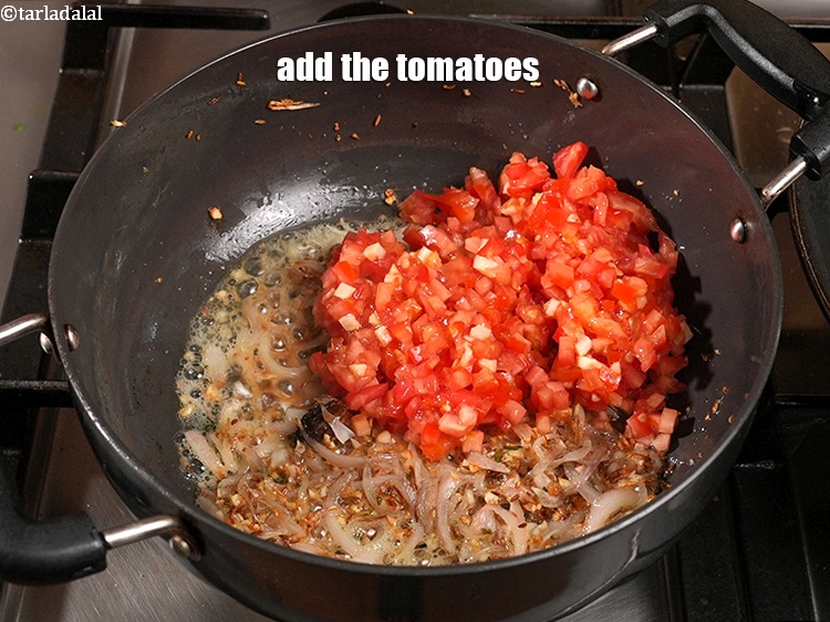 Step 29 – Add 1 cup&nbsp;finely&nbsp;<a href="https://www.tarladalal.com/glossary-chopped-tomatoes-779i">chopped tomatoes</a>.