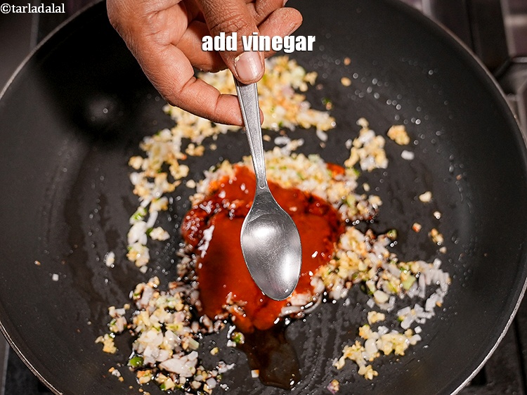 Step 28 – Add 1 tsp <a href="https://www.tarladalal.com/glossary-vinegar-sirka-cooking-vinegar-341i">vinegar</a>.