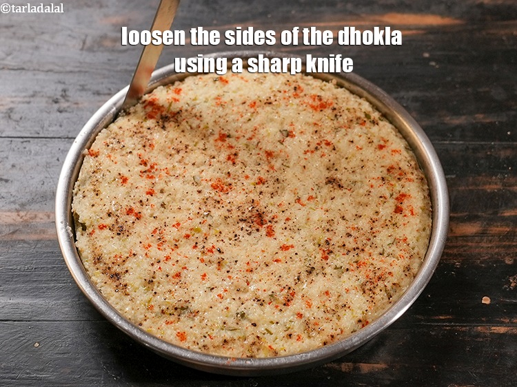 Step 29 – Loosen the sides of the dhokla using a sharp knife.