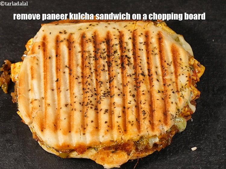 Step 29 – Remove paneer kulcha sandwich on a chopping board.
