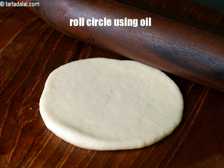 Step 29 – Roll out a portion into a 75 mm. (3&rdquo;) diameter circle using a little oil.