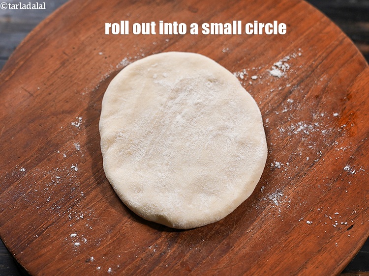 Step 30 – Roll out one portion of the dough into a small circle using some flour for …