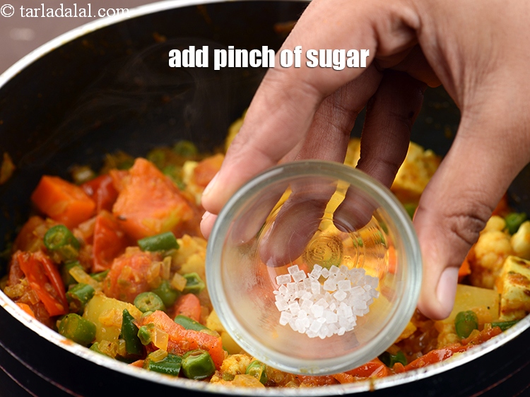 Step 34 – Add a pinch of <a href="https://www.tarladalal.com/glossary-sugar-chini-shakkar-278i">sugar</a>.