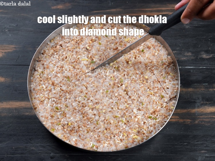 Step 29 – Cool slightly and cut the dhokla into diamond shape. This will give you 16 pieces …