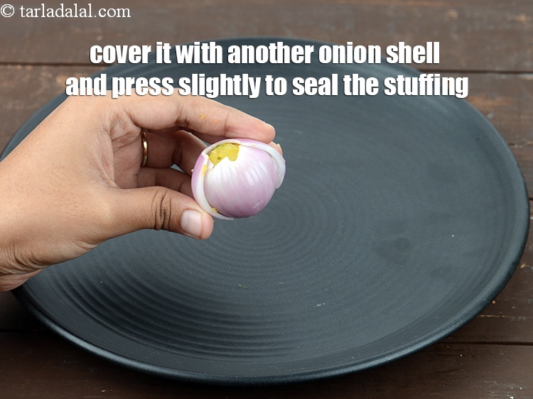 Step 32 – Cover it with another onion shell and press slightly to seal the stuffing. Ensure that …