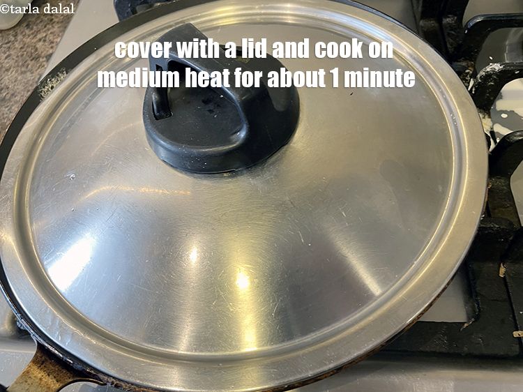 Step 29 – Cover with a lid and cook on a medium flame for about 1 minute.