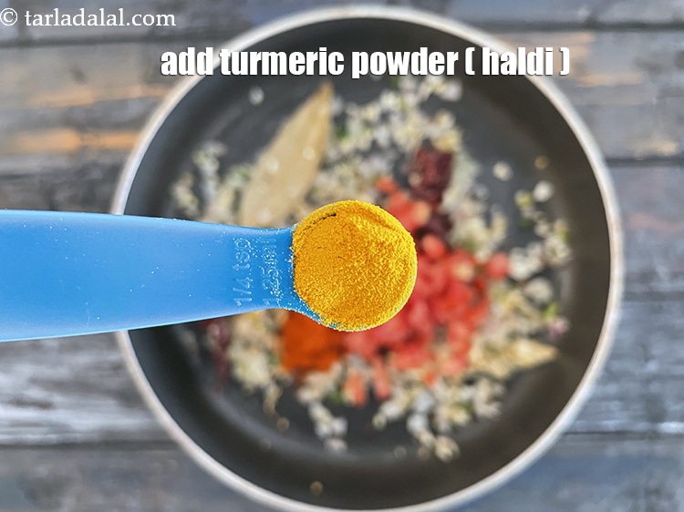 Step 29 – Add&nbsp;<meta charset="UTF-8" />1/4 tsp&nbsp;<a href="glossary-turmeric-powder-haldi-645i">turmeric powder (haldi)</a>.