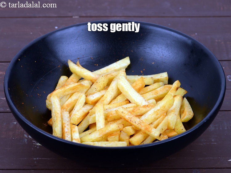Step 31 – Toss gently. Crispy peri peri French fries are ready. Keep aside.&nbsp;