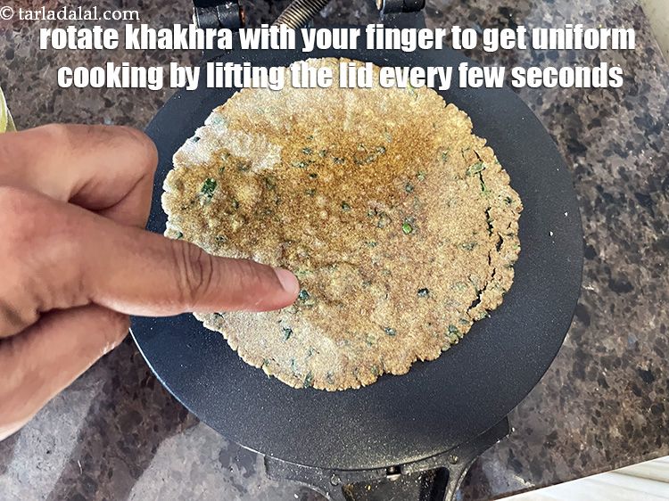 Step 42 – Rotate the khakhra being cooked with your finger every few seconds, by lifting the lid. …