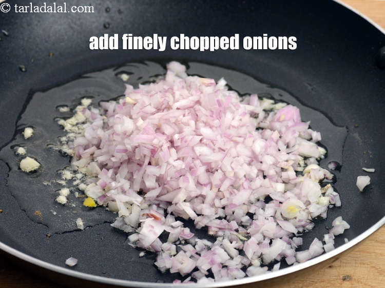 Step 31 – Add 1/2 cup finely <a href="https://www.tarladalal.com/glossary-chopped-onions-722i">chopped onions</a>.