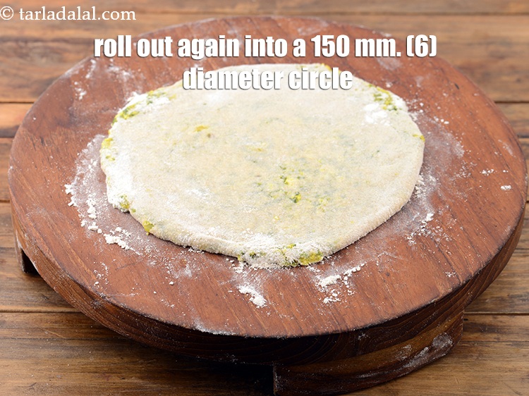 Step 30 – Roll out again into a 150 mm. (6&quot;) diameter circle, using a little whole wheat …