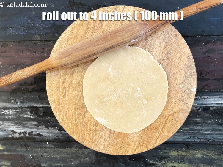 Step 32 – Roll out one portion of the dough into a 100 mm. (4") diameter circle using …