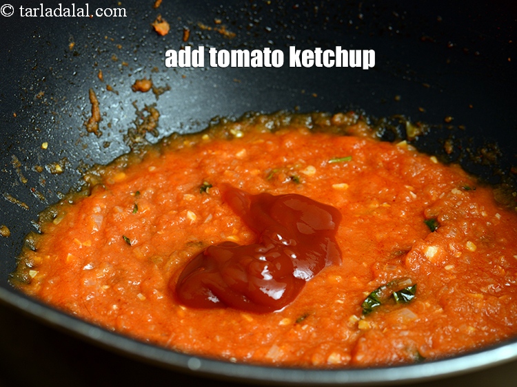 Step 31 – Add 1 tbsp <a href="https://www.tarladalal.com/glossary-tomato-ketchup-tomato-sauce-181i">tomato ketchup</a>.