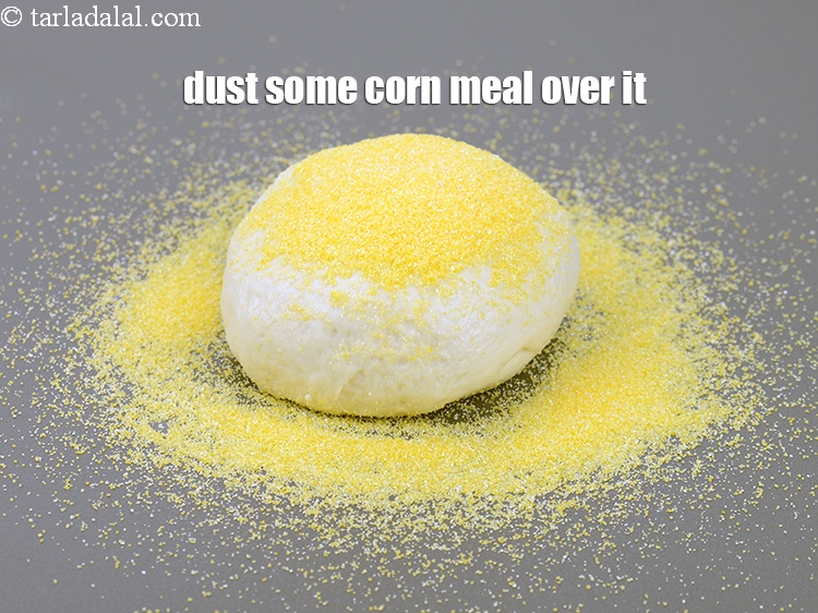 Step 29 – Dust some corn meal over it. It makes pizza base crispy. Corn meal can be …