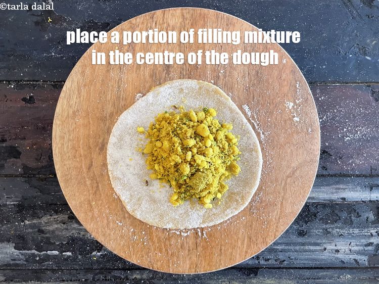 Step 45 – Place a portion of the filling mixture in the centre of the dough circle.