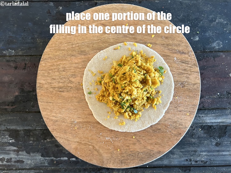 Step 39 – Place one portion of the filling in the center of the circle.