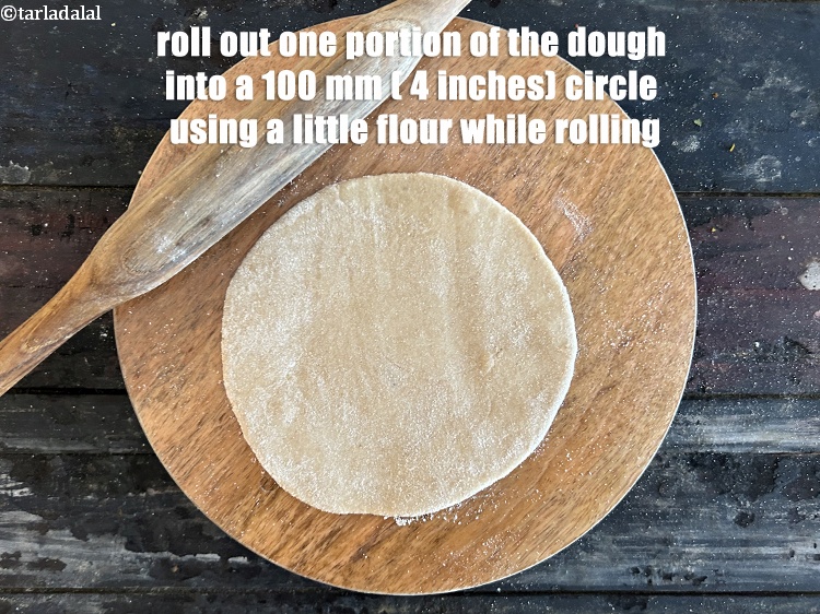 Step 34 – Roll out one portion of the dough into a 100 mm. (4&quot;) diameter circle using …