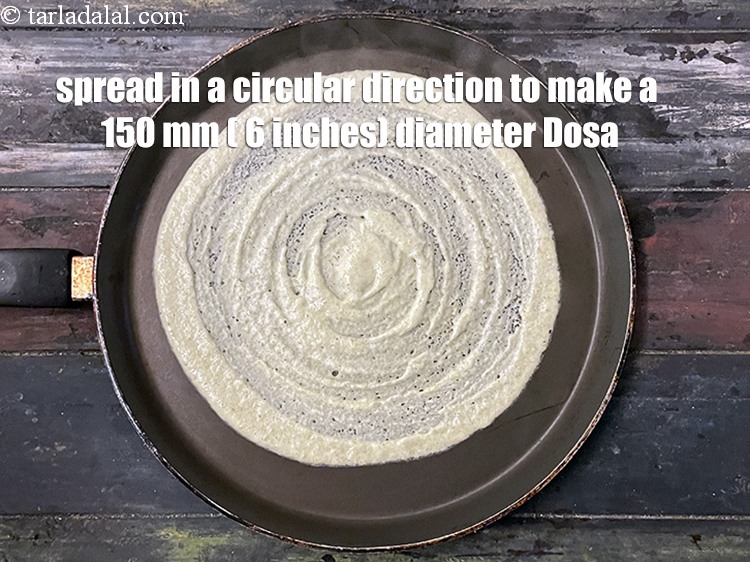 Step 30 – Spread in a circular motion to make a 150 mm. (6&rdquo;) diameter dosa.
