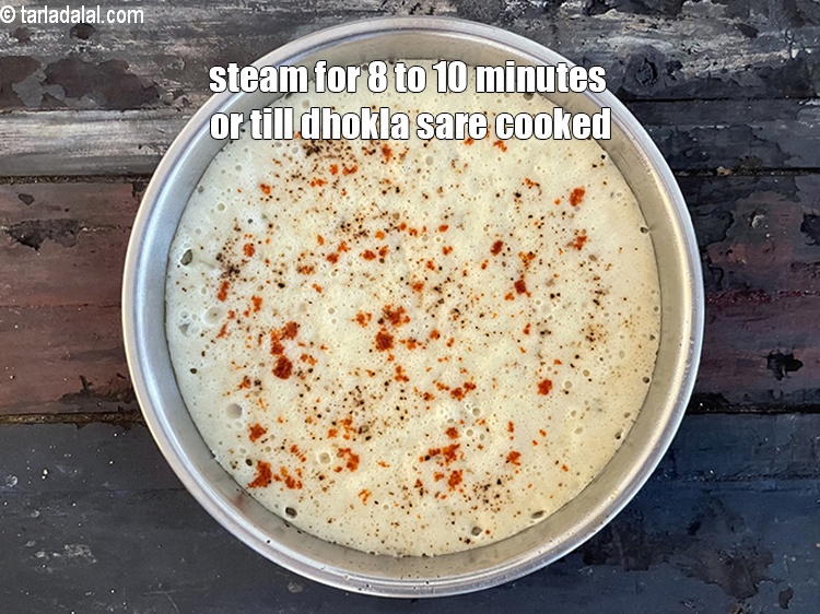 Step 29 – Steam in a steamer for 8 to 10 minutes or till the dhoklas are cooked.
