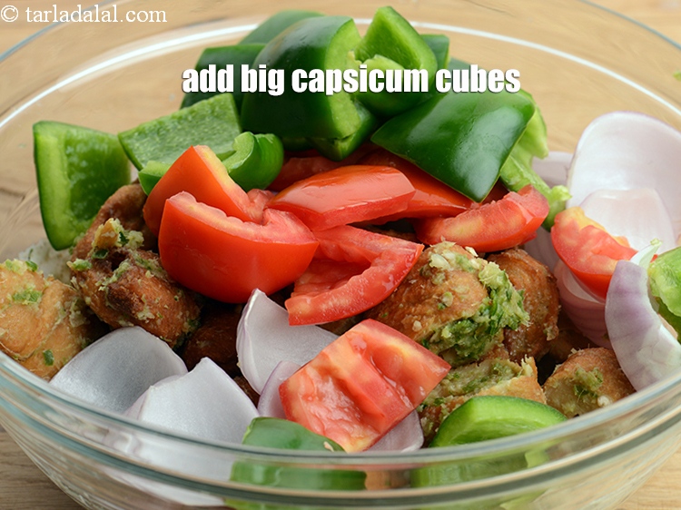 Step 32 – Add 1 cup big <a href="https://www.tarladalal.com/glossary-capsicum-cubes-170i">capsicum cubes</a>.