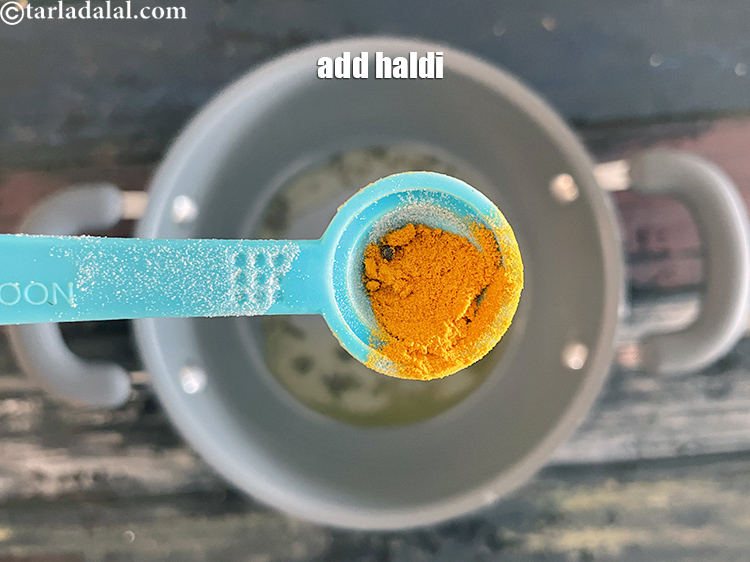 Step 30 – Add&nbsp;<meta charset="UTF-8" />1/4 tsp&nbsp;<a href="glossary-turmeric-powder-haldi-645i">turmeric powder (haldi)</a>.