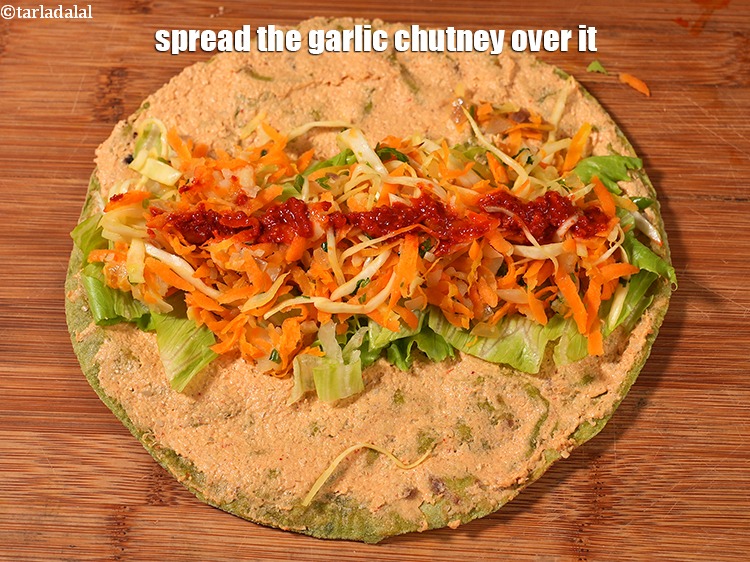 Step 32 – Spread 1 tsp of garlic chutney&nbsp;over it .